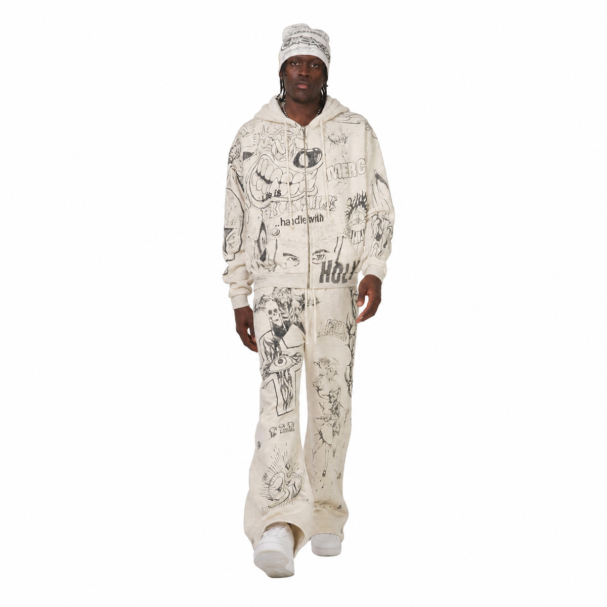 Model walking in the Hellstar Graffitti zip-up hoodie and Mirror Face sweatpants in grey